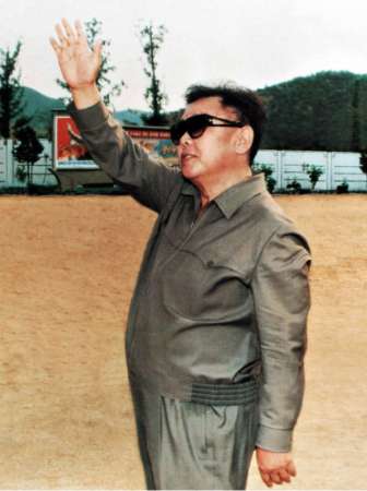 kimjongilwithbrowndirtbackdrop.jpg